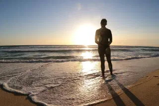 Surfer's Journey to Distant Shores