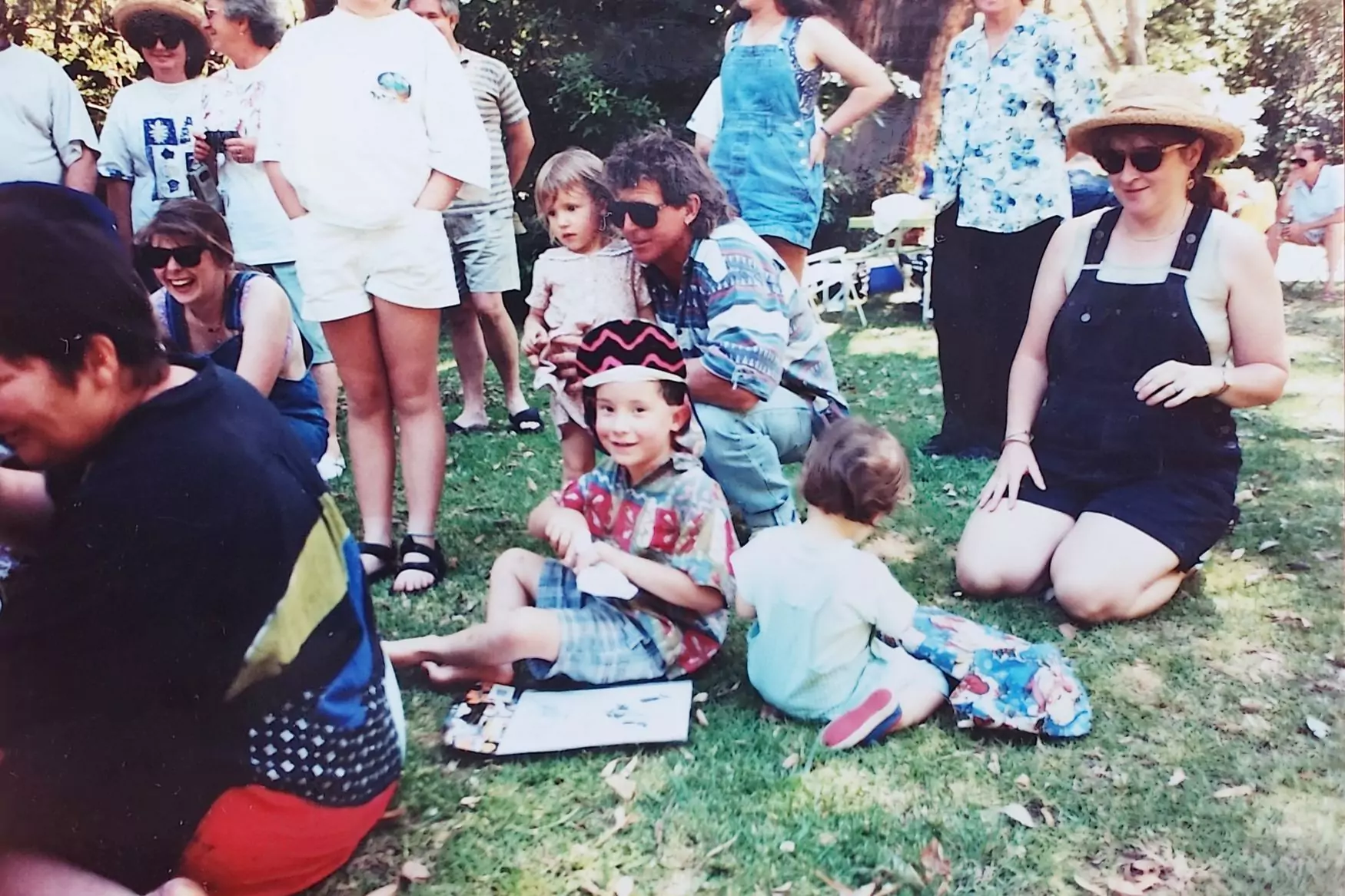 My father holding my sister in his arms.