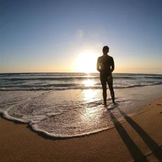 Surfer's Journey to Distant Shores