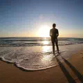 Surfer's Journey to Distant Shores